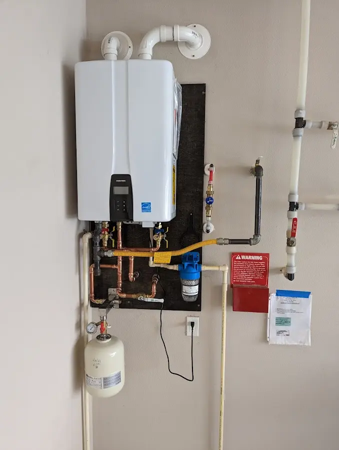 Professional plumber installing copper piping in a Chanceford home